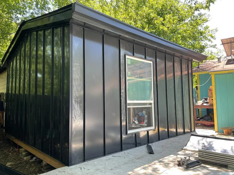 Black standing seam metal wall panels for Roof Inspection in West Odessa